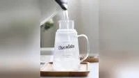 Jarra de agua de vidrio hecha a mano de vidrio Pyrex con tapa de tapa de taza